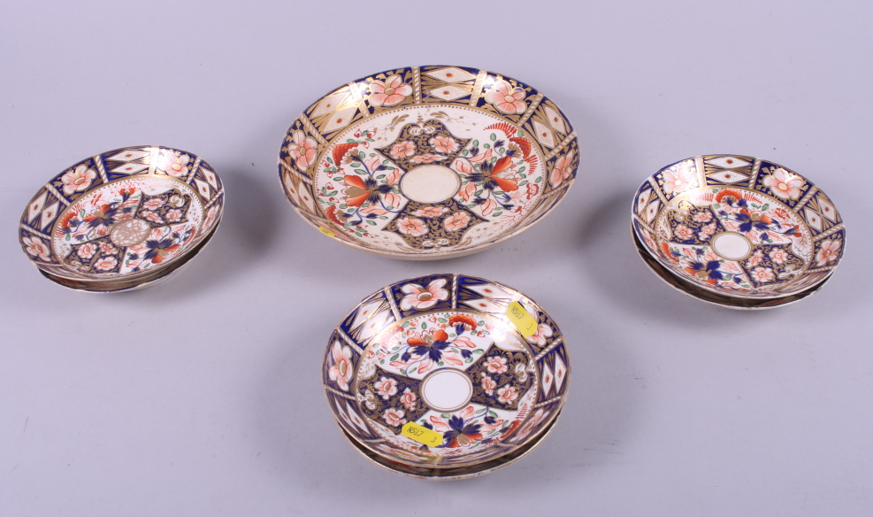 Six 19th century Derby "Imari" pattern saucers and a larger saucer dish, 8 1/2" dia