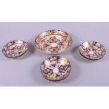 Six 19th century Derby "Imari" pattern saucers and a larger saucer dish, 8 1/2" dia