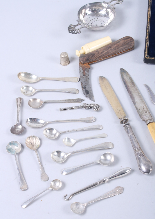 A selection of silver items, including condiment spoons, a tea strainer, two decanter labels, a - Image 2 of 4
