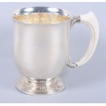 A silver christening tankard with ivory handle, 6.4oz troy approx