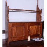 A late Victorian walnut wall cupboard with shelf over two doors, 24" wide