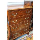 A mahogany chest of four long graduated drawers, on bracket supports, 24" wide