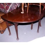 A Georgian Cuban mahogany circular drop leaf dining table, on turned supports and pad feet, 49" dia