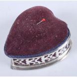 An Edwardian silver heart-shaped pincushion / jewellery box with pierced decoration