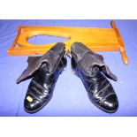 A pair of leather boots with spurs, by Moss Bros, and a boot jack