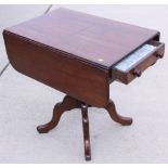 An early Victorian mahogany Pembroke table, fitted one drawer, on turned column and quadruple