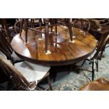 A 19th century rosewood circular tilt top breakfast table, on hexagonal column and triform base, 52"