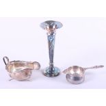 A silver tea strainer with stand, a silver sauce boat, 5.4oz troy approx, and a silver trumpet