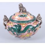 A Chinese porcelain incense burner, decorated dragons and clouds, Kylin handles and finial, 6" wide