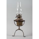 A ship's brass gimballed oil lamp and chimney, 10 1/2" high overall