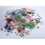 A quantity of costume jewellery, including bead necklaces, brooches and other items, all contained