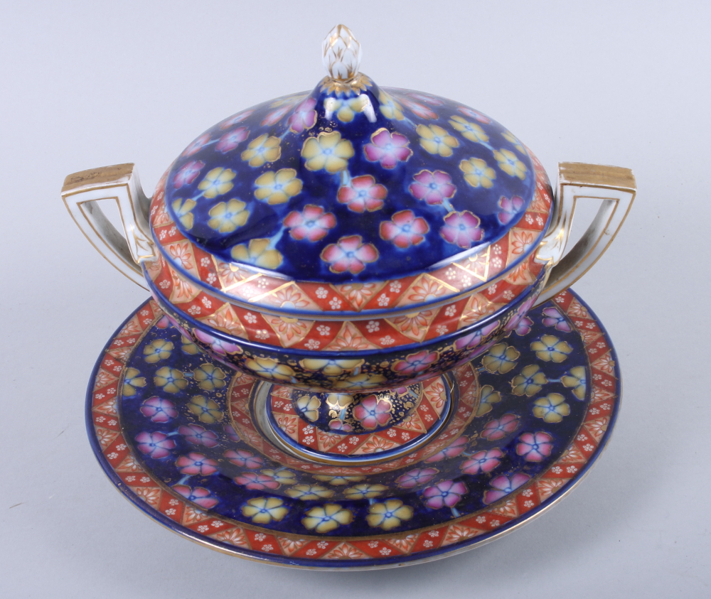 A 19th century Continental two-handled floral decorated bowl, cover and stand