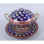 A 19th century Continental two-handled floral decorated bowl, cover and stand