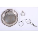 A pierced silver card tray, a silver cased lady's fob watch and a white metal lorgnette