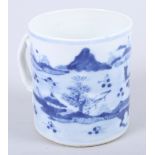 A 19th century Chinese blue and white mug with landscape decoration, 4" high (rim chips and crack)
