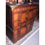 An antique Korean mulberry and hardwood side cabinet, fitted four drawers over two cupboards with