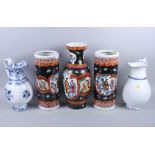 A pair of Chinese umbrella stands, a similar vase, 16" high, and two blue and white toilet jugs