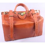 A Barrow and Hepburn brown leather luggage bag with brass fittings