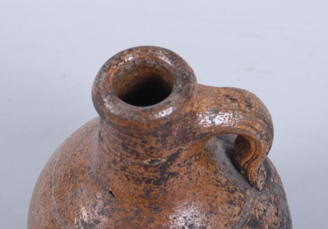A 17th century Continental brown salt glazed stoneware jug, 6 1/2" high - Image 3 of 4