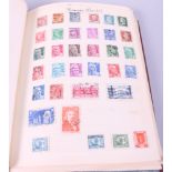 A collection of world stamps, in album