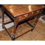 An 18th century oak side table, fitted one drawer, on slender baluster turned and stretchered