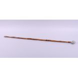 A swagger stick with Norfolk Regiment pommel