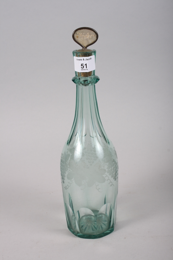 A mid 19th century green engraved glass spirit decanter with mother-of-pearl stopper, 13" high