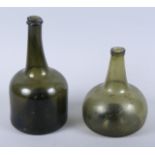 An 18th century green glass mallet-shaped wine bottle, 9 1/2" high, and a similar onion-shaped