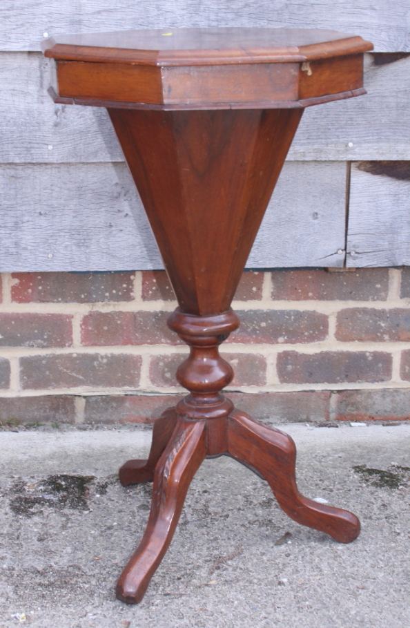 A Victorian walnut octagonal top work table, fitted central well, on tripod splay supports, 16"