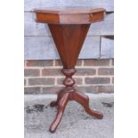 A Victorian walnut octagonal top work table, fitted central well, on tripod splay supports, 16"
