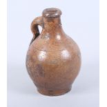 A 17th century Continental brown salt glazed stoneware jug, 6 1/2" high