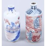 Two Chinese porcelain blue, white and iron red decorated cylindrical snuff bottles