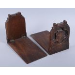 A pair of Victorian Gothic carved oak bookends