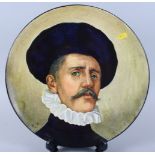 A Doulton Lambeth portrait charger, decorated gentleman with ruff collar, signed HT, 15 1/2" dia