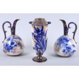 A pair of blue and white Doulton Burslem ewers with floral and gilt decoration, 8 1/2" high, and a