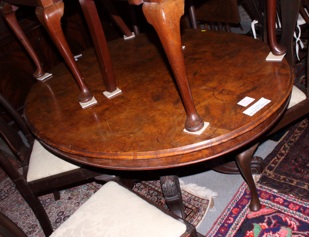 A 19th century figured walnut oval loo table, on turned and carved quadruple splay supports, 53" - Image 3 of 3