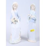 A Lladro figure of a woman holding lilies, 9" high, and a Lladro figure of a seated girl with