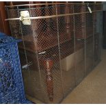 A 19th century brass wirework nursery fire guard with adjustable drying rail, 50" wide