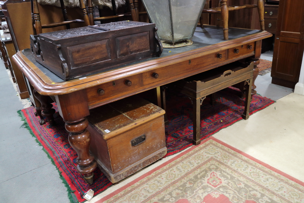 A 19th century mahogany library table, fitted one long and two short drawers, inset leather top,