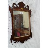 A mahogany framed wall mirror of early Georgian design, plate 13 1/2" x 9 1/2"