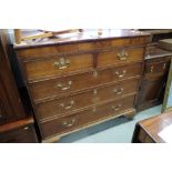A 19th century oak and mahogany chest of two short and three long graduated drawers, on ogee bracket