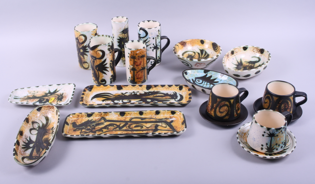 A collection of Celtic studio pottery including six cups, in sizes, a jug, a vase, dishes, etc