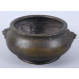 A Chinese bronze shallow censer with lion mask handles and six character seal mark to base, 4" high