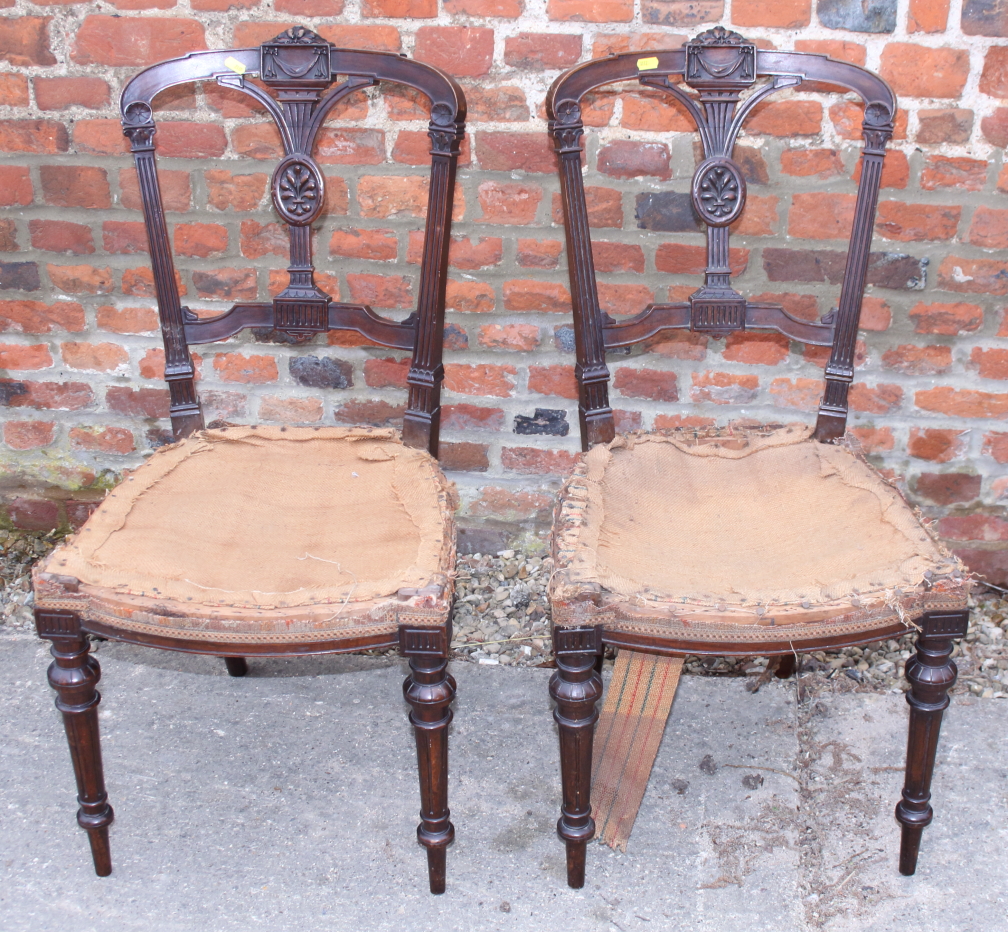 A pair of late 19th century walnut frame Louis XVI design side chairs, on turned supports (for re-