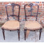 A pair of late 19th century walnut frame Louis XVI design side chairs, on turned supports (for re-