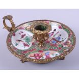 A Chinese famille verte chamberstick, in an ormolu gilt mount