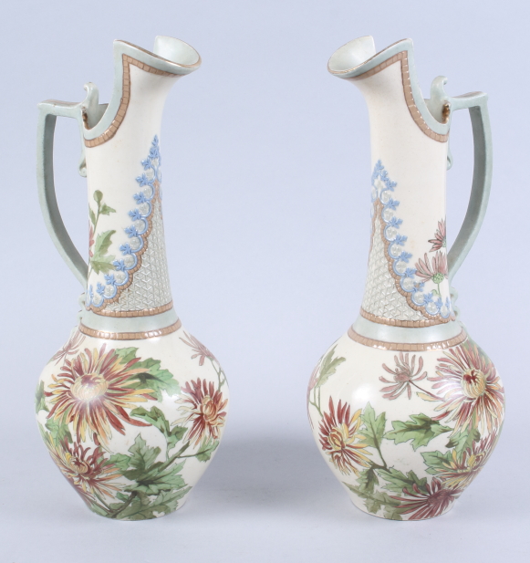 A pair of Doulton Lambeth ewers, with chrysanthemum decoration, 12 1/2" high