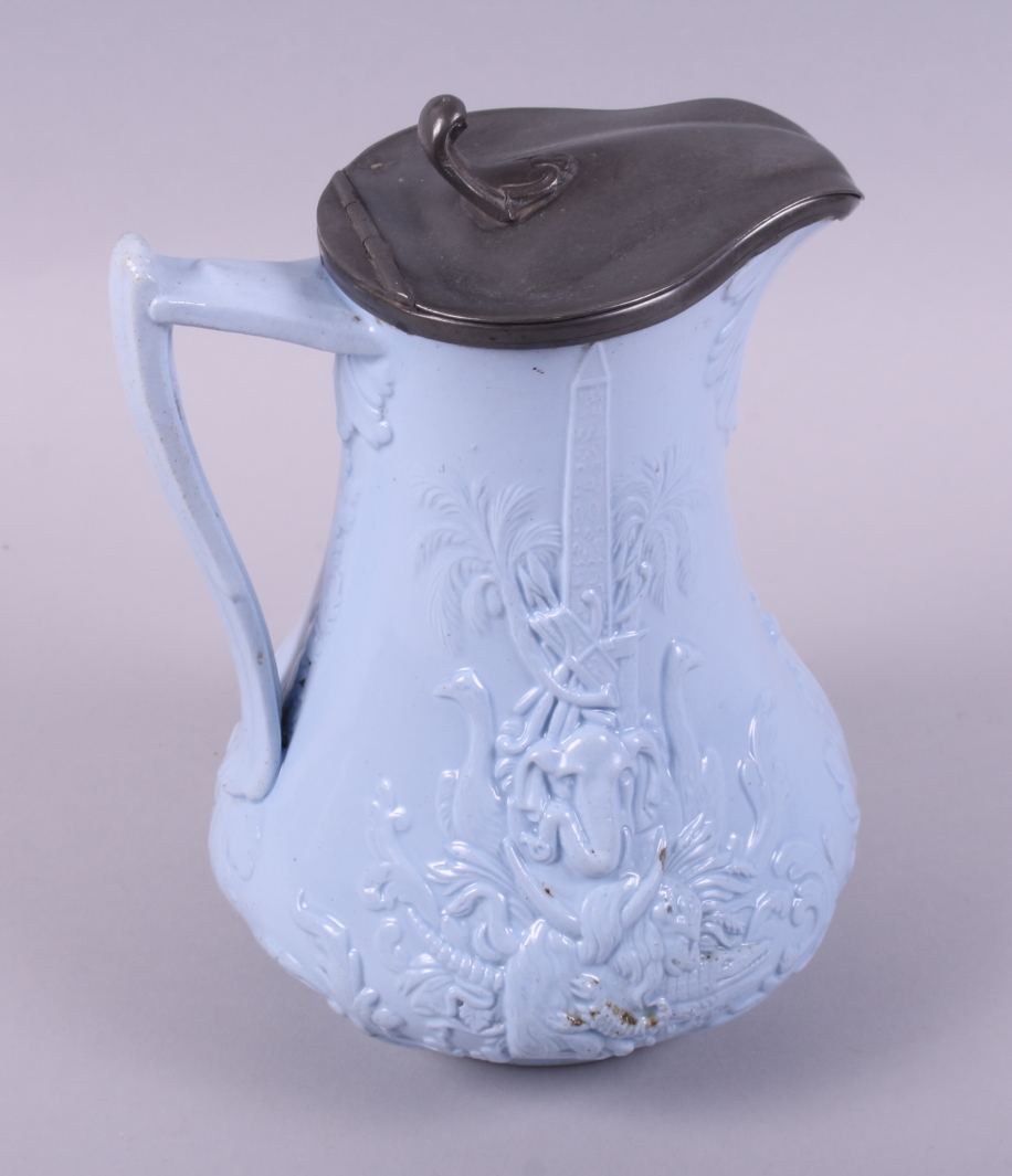 A 19th century blue glazed relief moulded jug, decorated exotic animals and war trophies (Europe and - Image 3 of 7