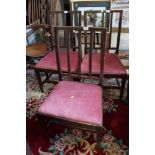 A set of three 19th century mahogany vertical rail back standard chairs with drop-in seats, on