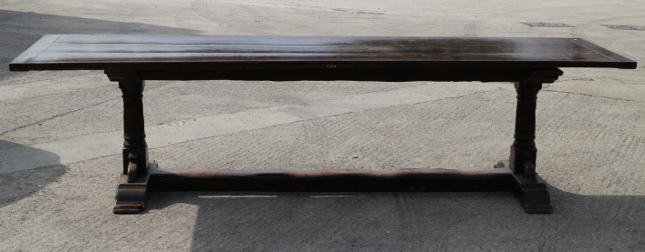 An oak plank top refectory table, on turned fluted column and stretchered supports, top 114" x 30"